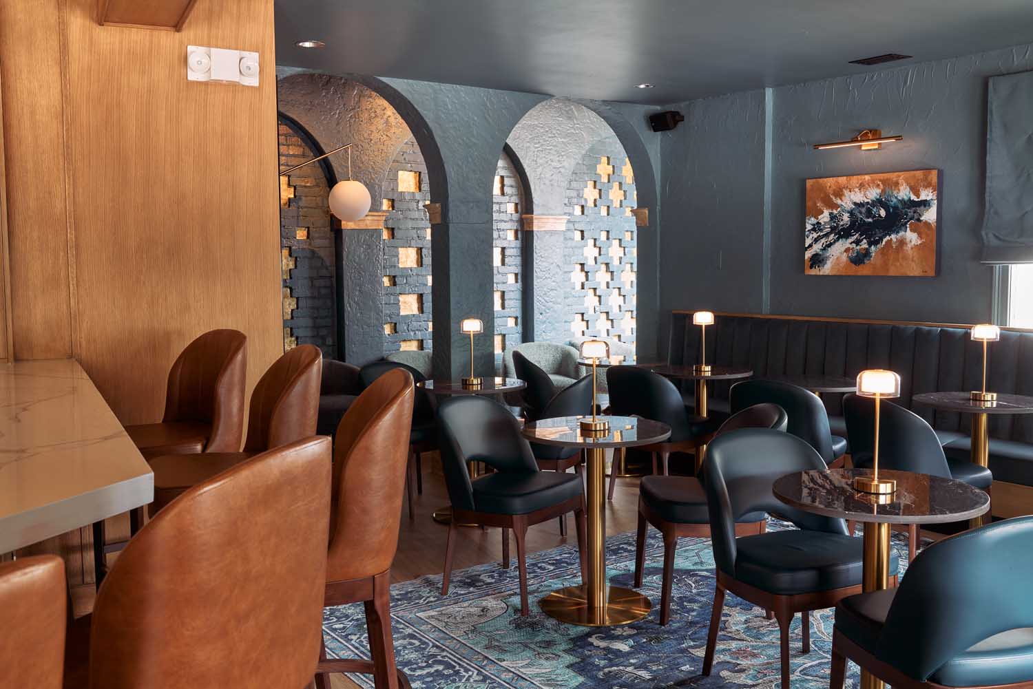 interior shot of Sala bar with slate grey wall and modern furniture